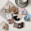 Milk coffee style bow hair band, Korean simple leather band, French retro versatile hair tie, new popular hair tie and hair accessory Application Scenario